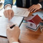 Real Estate broker or sale agent giving consultation to customer